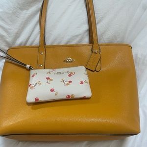 Mustard yellow Coach tote and wristlet!